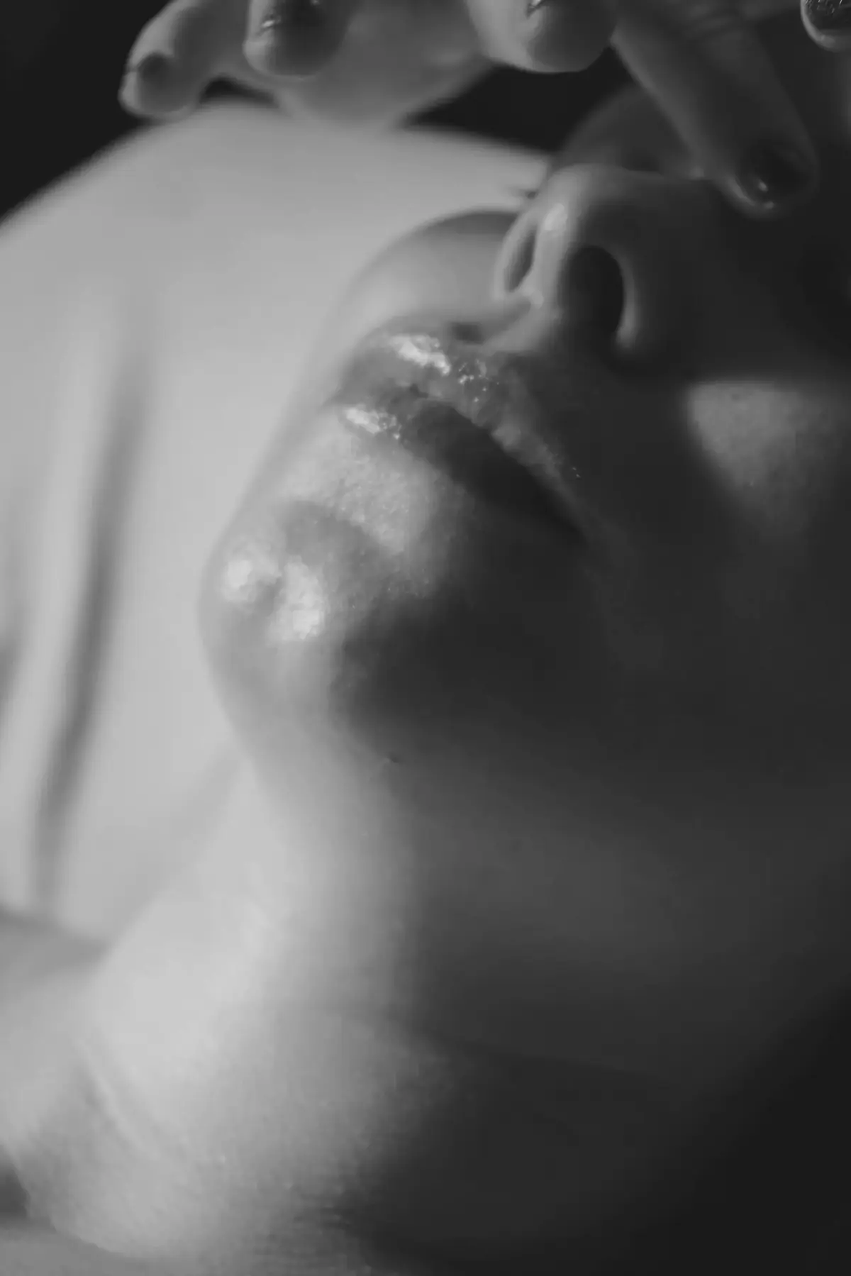 Close view of lips and jaw during a gentle facial massage