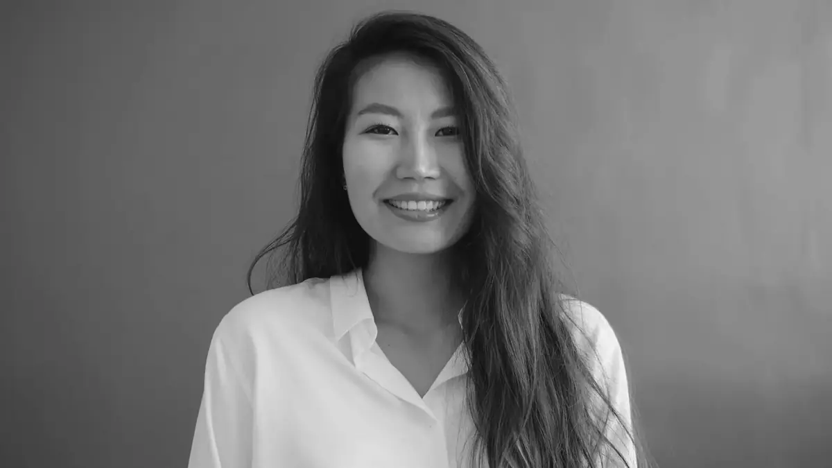 June Takahara, founder of Halden, smiling in a white shirt
